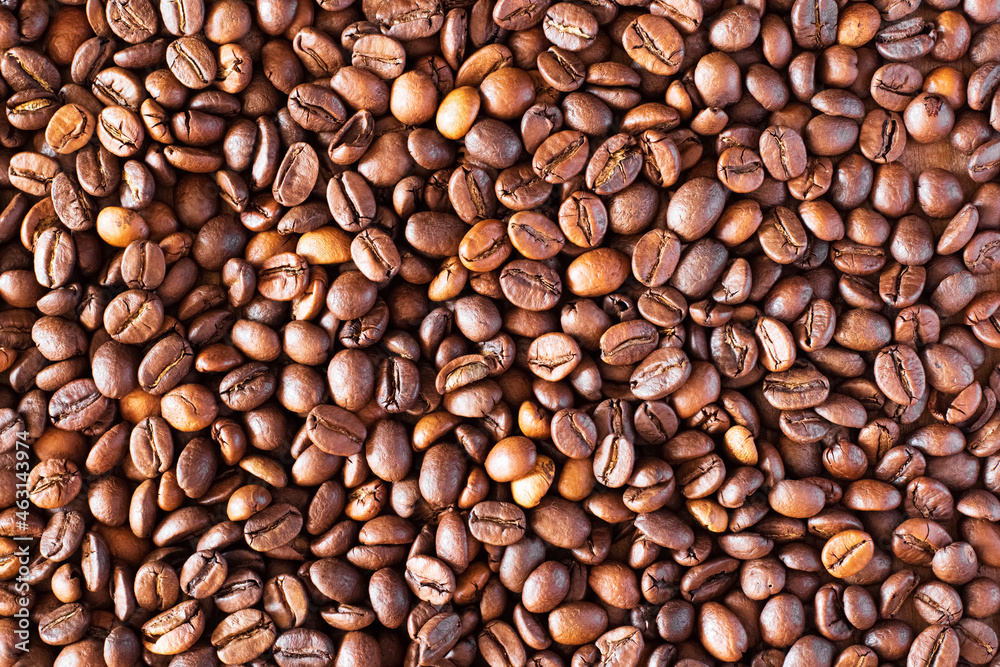 Fototapeta premium Brown coffee beans close-up as background
