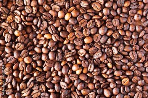 Brown coffee beans close-up as background