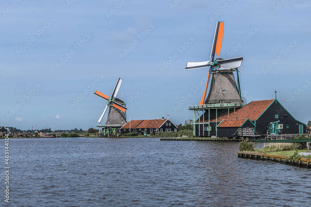 Traditional Dutch old wooden windmill in Zaanse Schans - village in Zaandam. The Netherlands. 