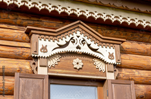 Windows of wooden house decorated with wooden carvings