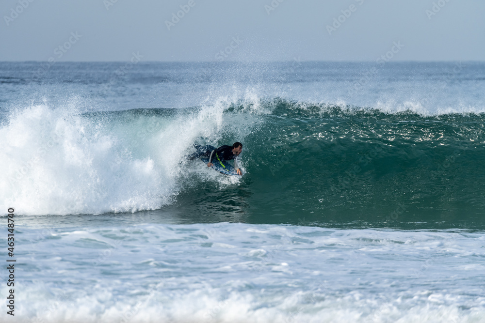 Bodyboarder riding a wave