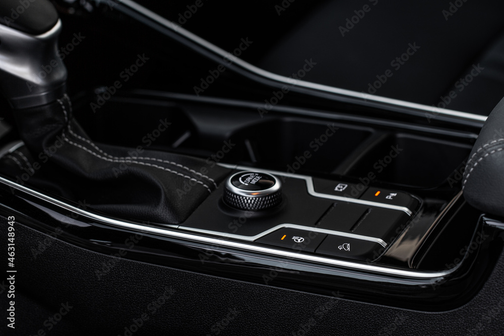 Naklejka premium Drive selector button. Automatic gear lever and gear shift. Car interior, offroad drive controller closeup view. Wheel drive selectiob. Four-Wheel Drive transmission selection system.