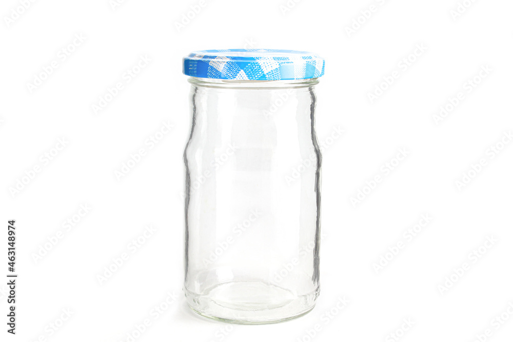 Empty glass jar with retro looking blue cap isolated on white background Empty glass jar with retro looking blue cap isolated on white background