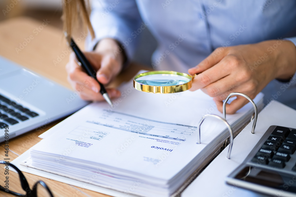 Lawyer Examining Invoice Using Magnifier Glass Lawyer Examining Invoice Using Magnifier Glass