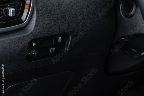 Trunk electric close and lock button close up view. Vehicle interior detail of a modern car.