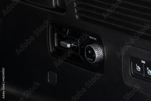 Сontrol panel car air conditioner dashboard. Modern car interior conditioning buttons inside a car close up view. © Roman