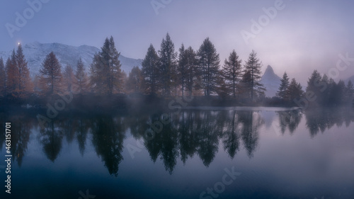 Foggy lake, forest and Matterhorn