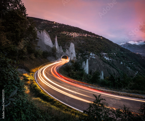 Light trails of traffic leading through tunnel. photo