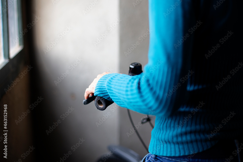 Woman put yours hands together next to a window Woman put yours hands together next to a window