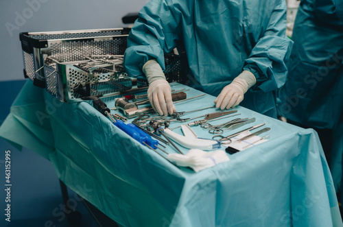 Nurse and surgical tools in hospital photo