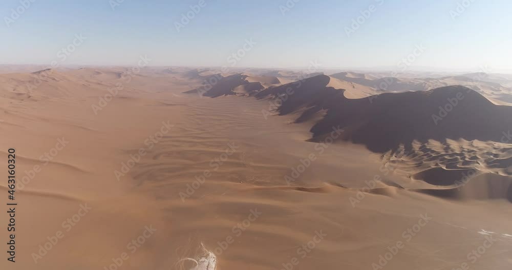 pan to the left aerial shot from the greatest sand dunes in the Dasht-e Lut desert, aerial shot from the great sand dunes in the world pan to the left aerial shot from the greatest sand dunes in the Dasht-e Lut desert, aerial shot from the great sand dunes in the world