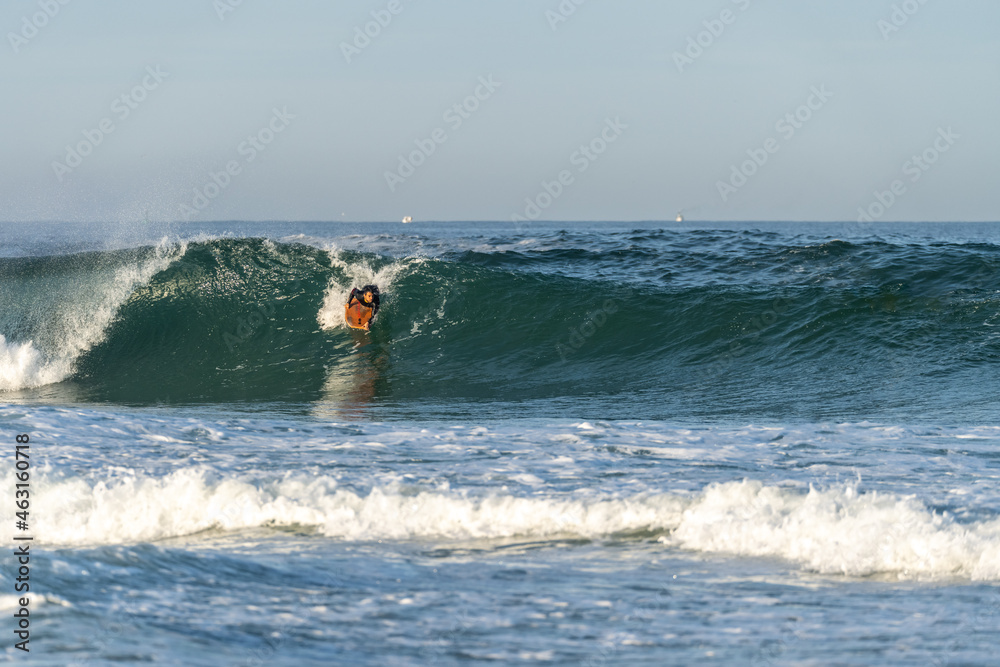 Bodyboarder riding a wave Bodyboarder riding a wave