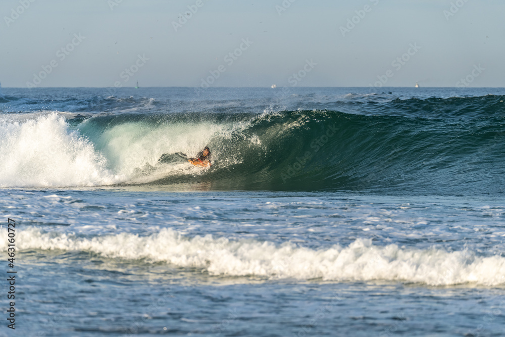 Bodyboarder riding a wave Bodyboarder riding a wave