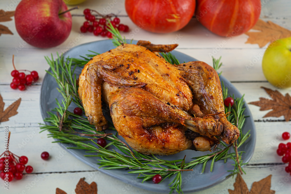Baked whole chicken or turkey. Roasted homemade chicken with herbs. Thanksgiving day decoration Baked whole chicken or turkey. Roasted homemade chicken with herbs. Thanksgiving day decoration