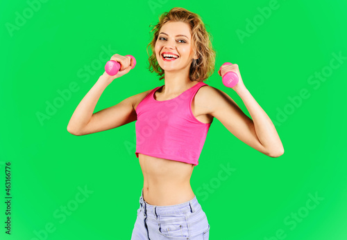 Sport, exercising, training and lifestyle. Happy Sporty woman with dumbbells. Fitness girl Workout.