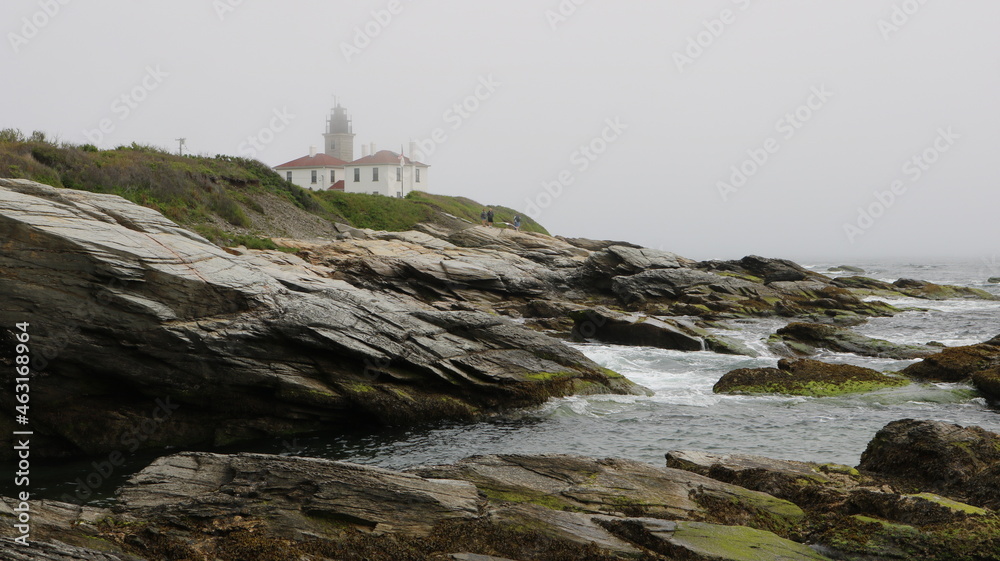 rock outcroppings mist lighthouse
