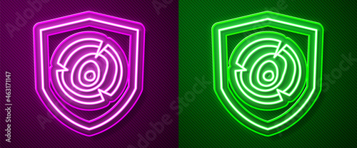 Glowing neon line Wooden logs icon isolated on purple and green background. Stack of firewood. Vector