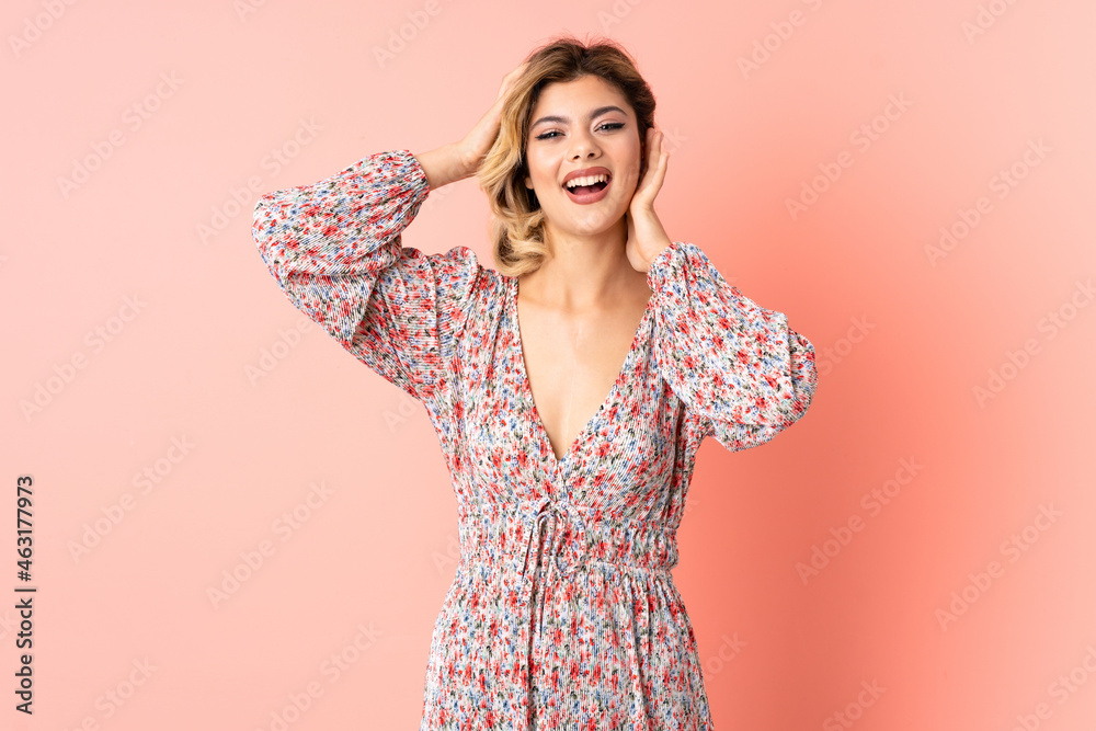 Young Russian woman isolated on pink background laughing Young Russian woman isolated on pink background laughing