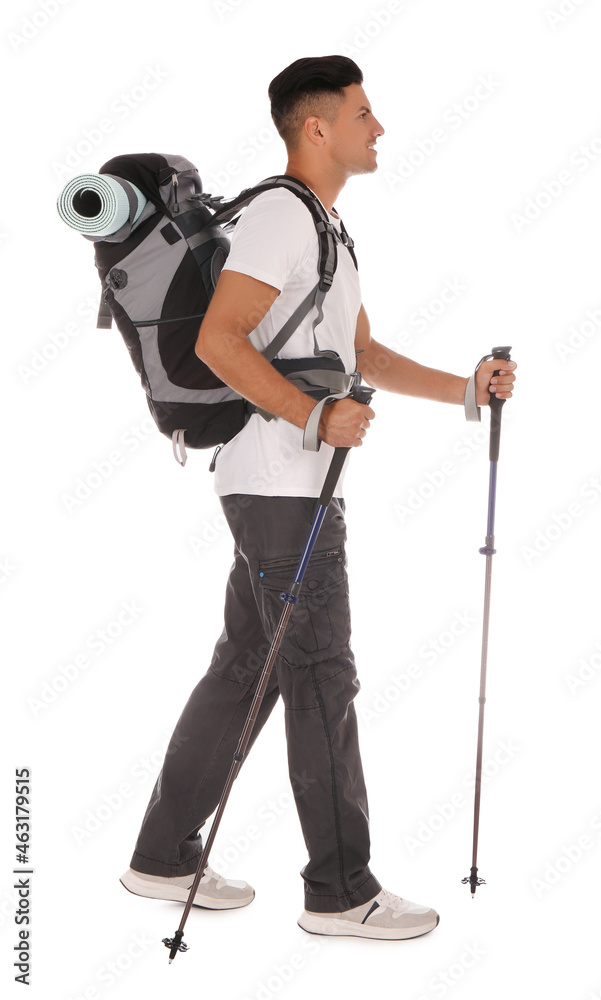 Male hiker with backpack and trekking poles on white background Male hiker with backpack and trekking poles on white background