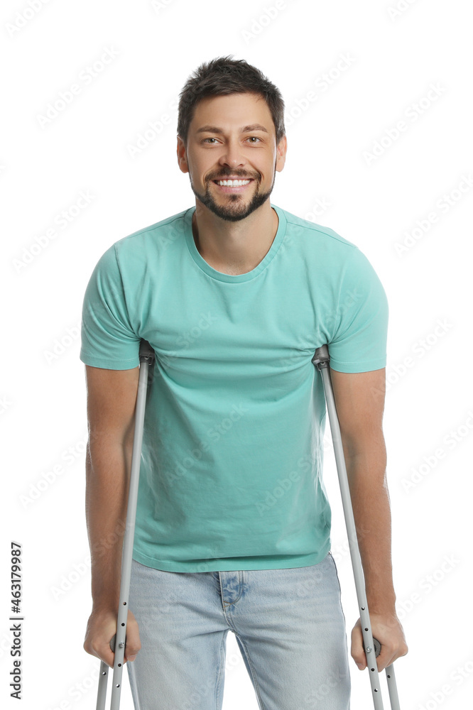 Portrait of happy man with crutches on white background Portrait of happy man with crutches on white background
