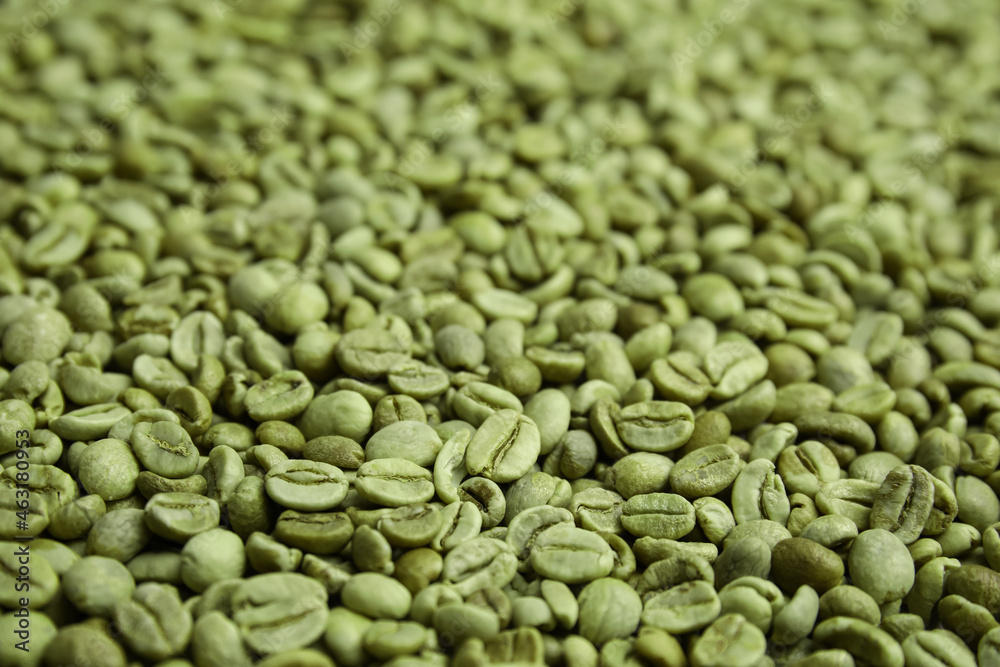 Pile of green coffee beans as background, closeup Pile of green coffee beans as background, closeup