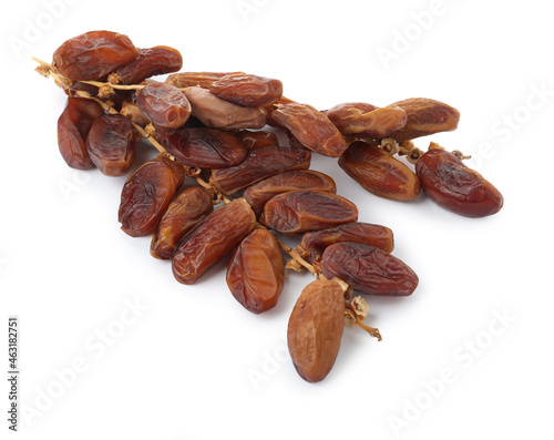 Sweet dates on branches against white background. Dried fruit as healthy snack