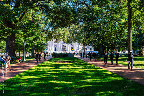 U.S Naval Academy, Bancroft Hall, Annapolis, Maryland. Walkway with trees and people  photo