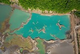 Drone view of the turquoise lake formed as a result of mining waste