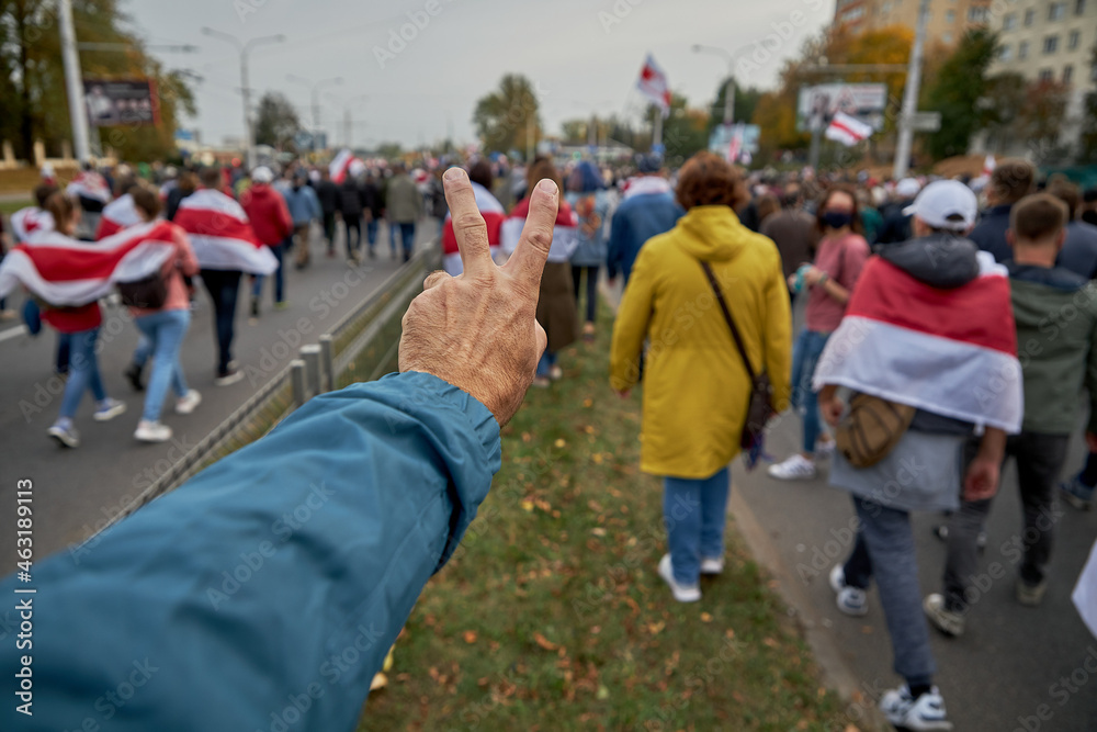 October 4 2020 Minsk Belarus Protests in Belarus A man's hand with the sign of freedom on the blurred background of the demonstration