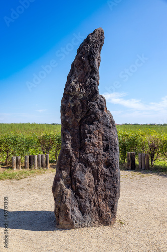 Menhir Stone Shepherd / Stony man (the hightest menhir in CR, 3.5 m, 5 tons, sandstone), Klobuky near town Slany, Central Bohemia, Czech republic, Europe photo