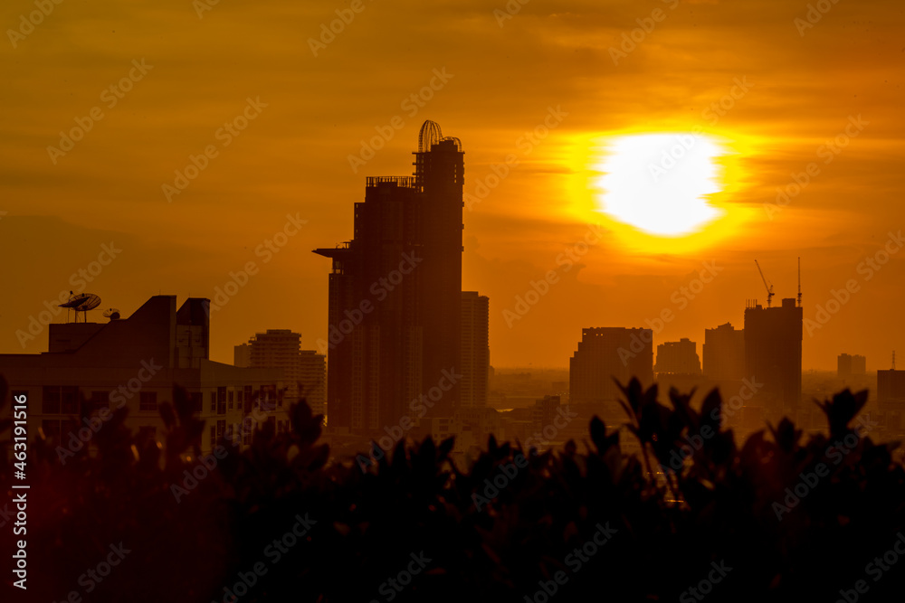 The high angle background of the city view with the secret light of the evening, blurring of night lights, showing the distribution of condominiums, dense homes in the capital community The high angle background of the city view with the secret light of the evening, blurring of night lights, showing the distribution of condominiums, dense homes in the capital community