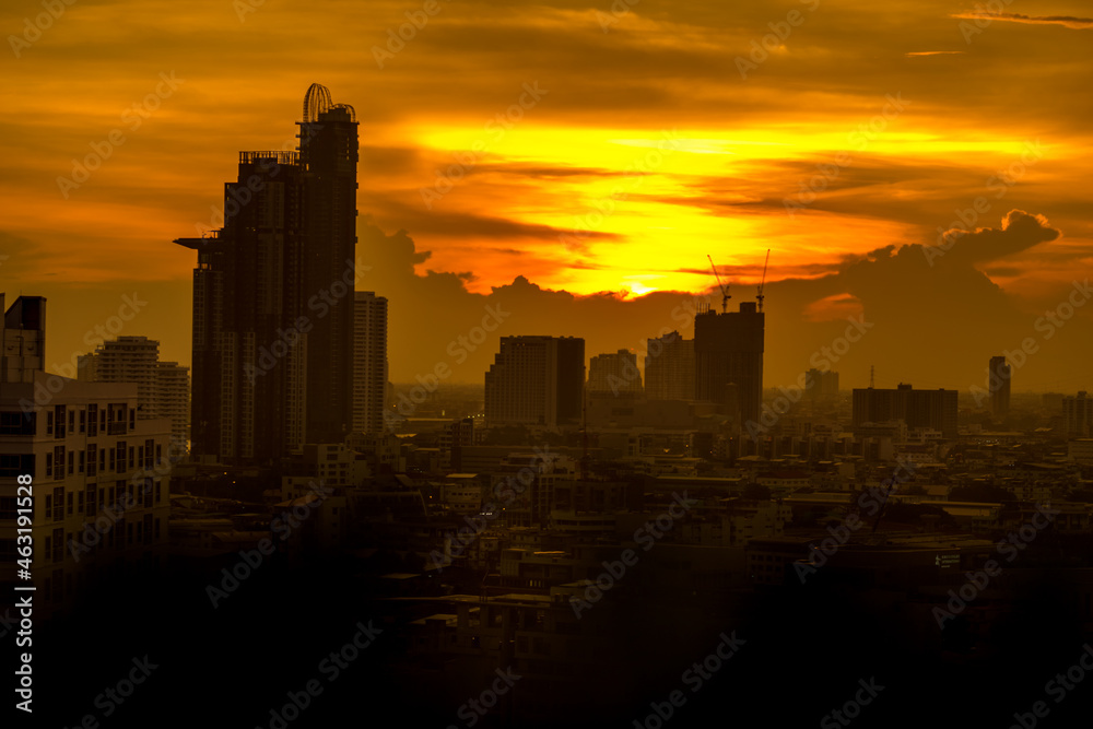 The high angle background of the city view with the secret light of the evening, blurring of night lights, showing the distribution of condominiums, dense homes in the capital community The high angle background of the city view with the secret light of the evening, blurring of night lights, showing the distribution of condominiums, dense homes in the capital community