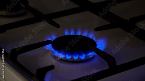 Gas burning in the burner of gas stove, gas shortage and crisis photo