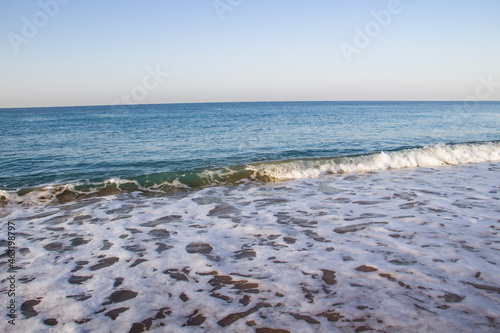 Beautiful seascape with sea waves and sand. Sea waves on the beach.