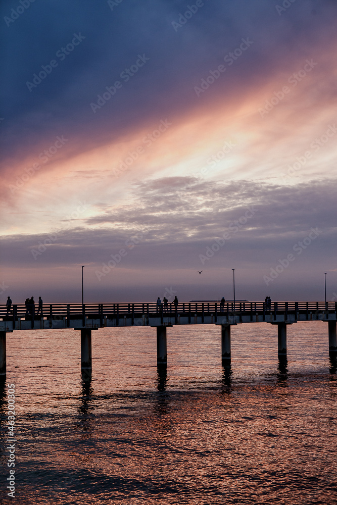lilac sunset over the sea, promenade, pier