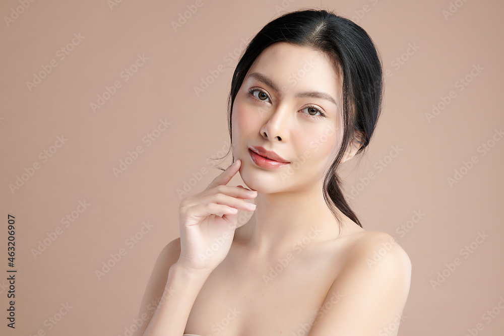 Beautiful young asian woman with clean fresh skin on beige background, Face care, Facial treatment, Cosmetology, beauty and spa, Asian women portrait. Beautiful young asian woman with clean fresh skin on beige background, Face care, Facial treatment, Cosmetology, beauty and spa, Asian women portrait.