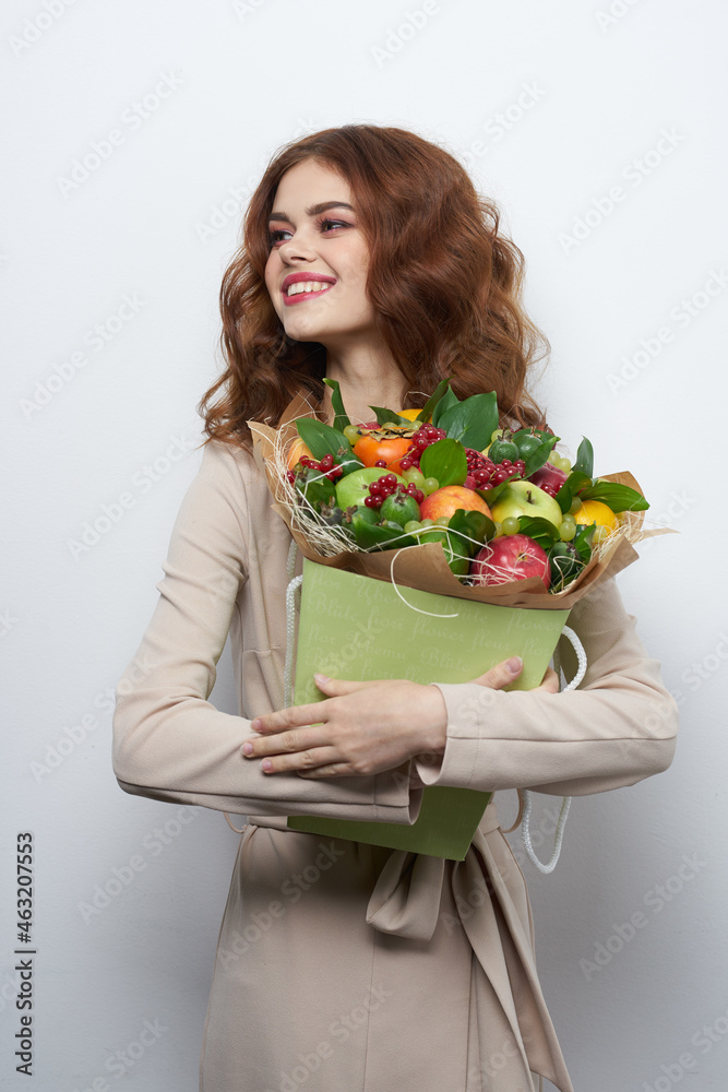 cheerful woman smile posing fresh fruits bouquet emotions light background cheerful woman smile posing fresh fruits bouquet emotions light background