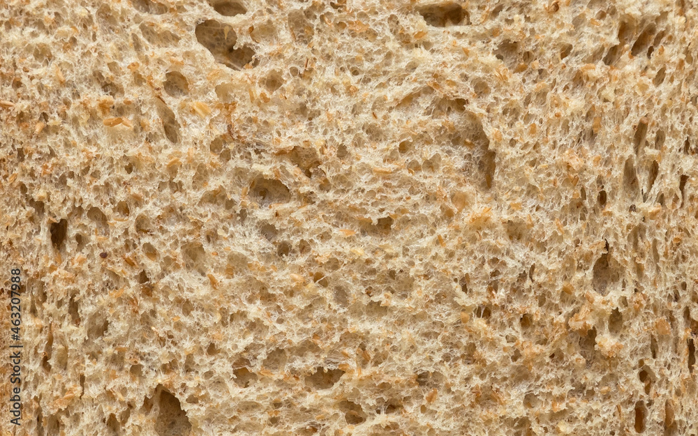 A close up of wholemeal bread background and texture. A close up of wholemeal bread background and texture.