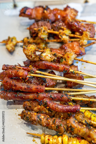 A plate of grilled skewers with rich ingredients