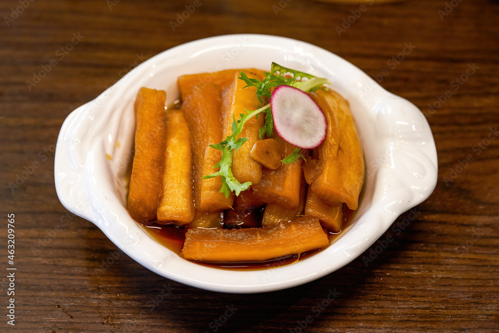 An appetizing cold dish, pickled radish in sauce An appetizing cold dish, pickled radish in sauce