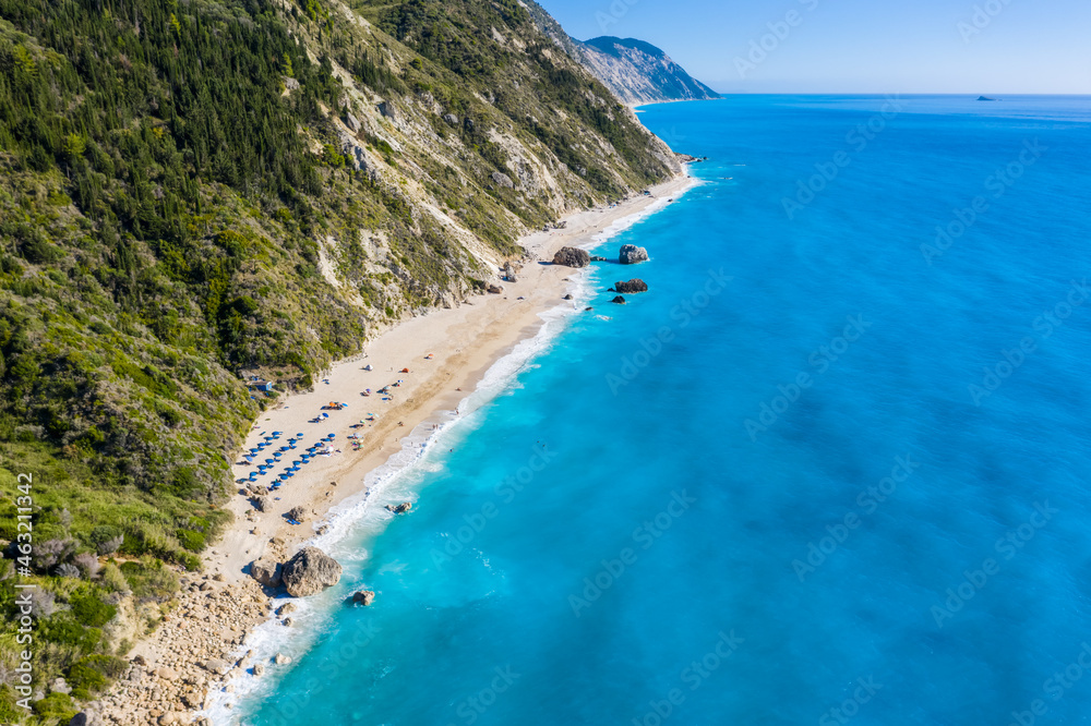 Aerial view of Kalamitsi beach with big boulders in turquoise blue Ionian Sea, Lefkada island, Greece