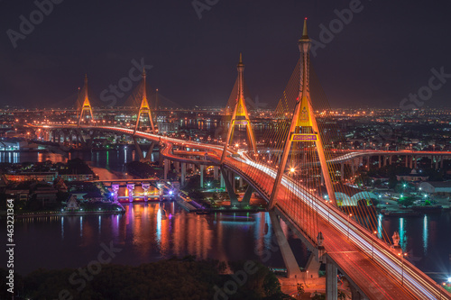 Aerial view of Bhumibol Bridge and Chao Phraya River in structure architecture concept, Urban city, Bangkok. Downtown area at night, Thailand 