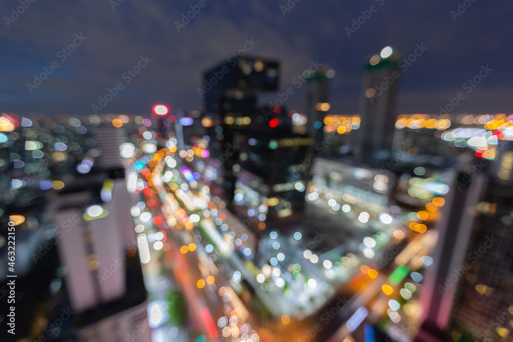 Footage scene of blurred defocused city shining and blinking light presenting at night time with bokeh 