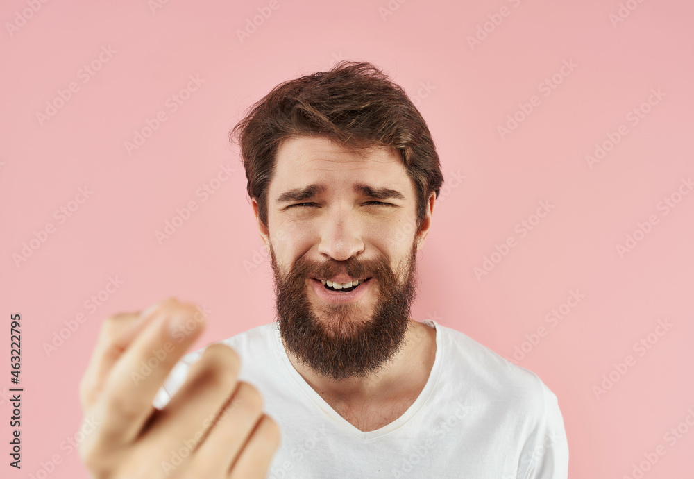 Man in a white t-shirt surprised look Studio Man in a white t-shirt surprised look Studio