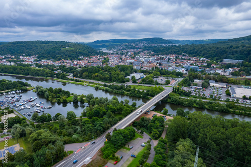 Aerial view around the city Merzig on a cloudy day in summer