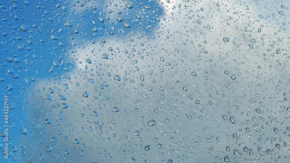 Raindrops on glass. Car window after washing. Slide from left to right Raindrops on glass. Car window after washing. Slide from left to right