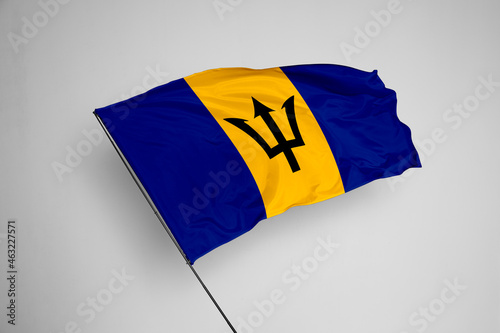 Barbados flag isolated on white background. close up waving flag of Barbados. flag symbols of Barbados. Concept of Barbados.