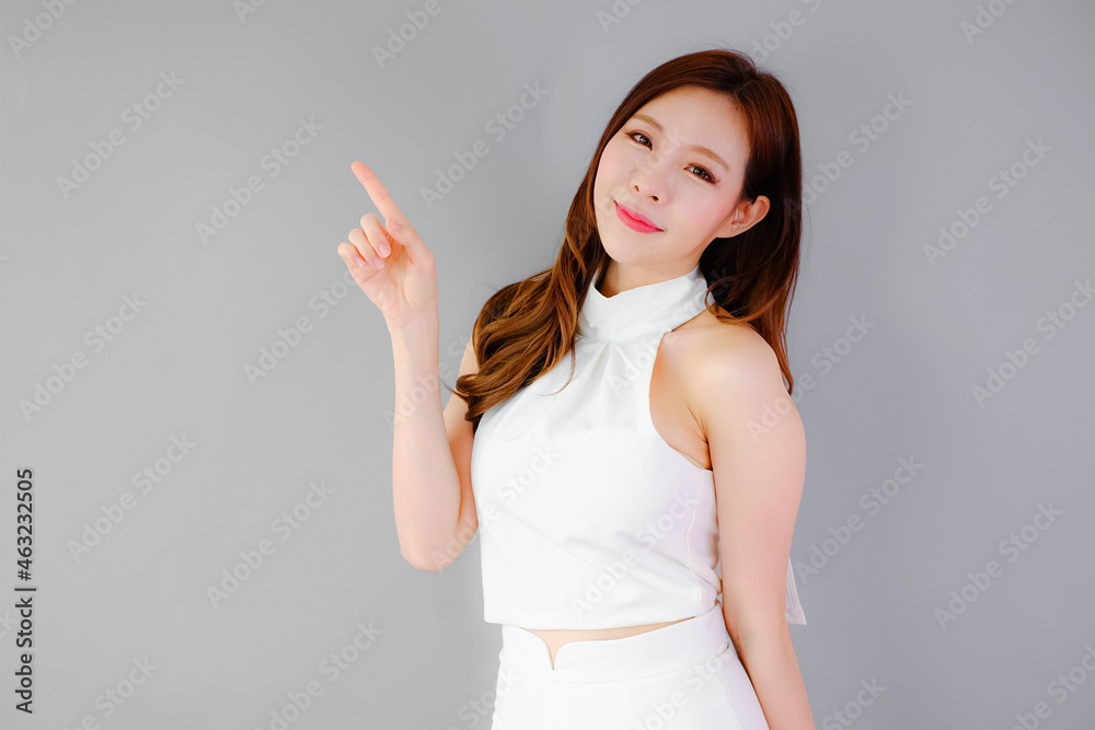 Portrait beautiful asian woman on gray background, emotions action Portrait beautiful asian woman on gray background, emotions action