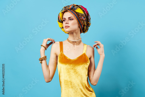 woman in multicolored turban luxury ethnicity blue background