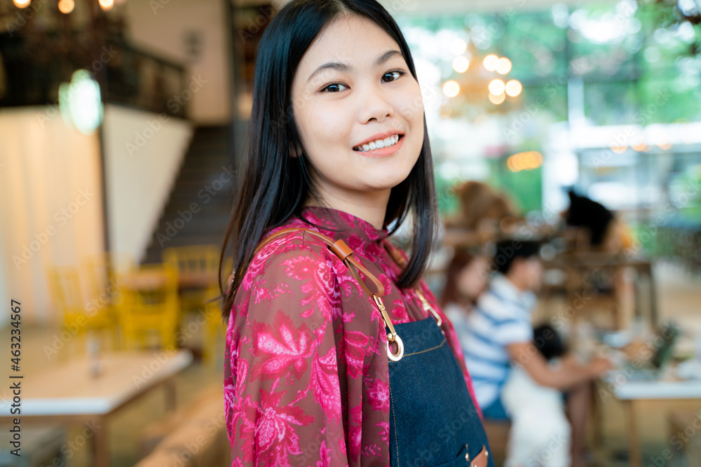 Happy business owner woman standing at coffee shop small business Happy business owner woman standing at coffee shop small business